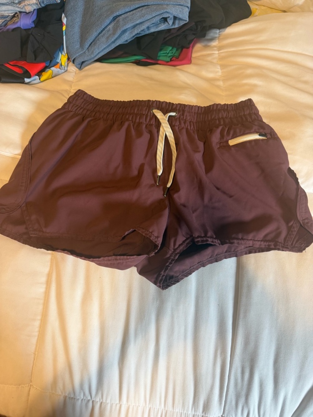 Vuori Women's Athletic Shorts in Maroon with Cream Drawstring